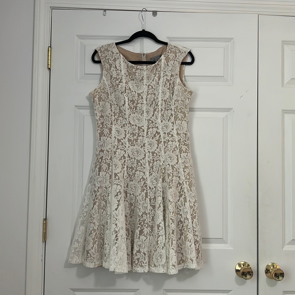 Off white and nude lace dress by Danny and Nicole’s. Size 16. Worn one time.